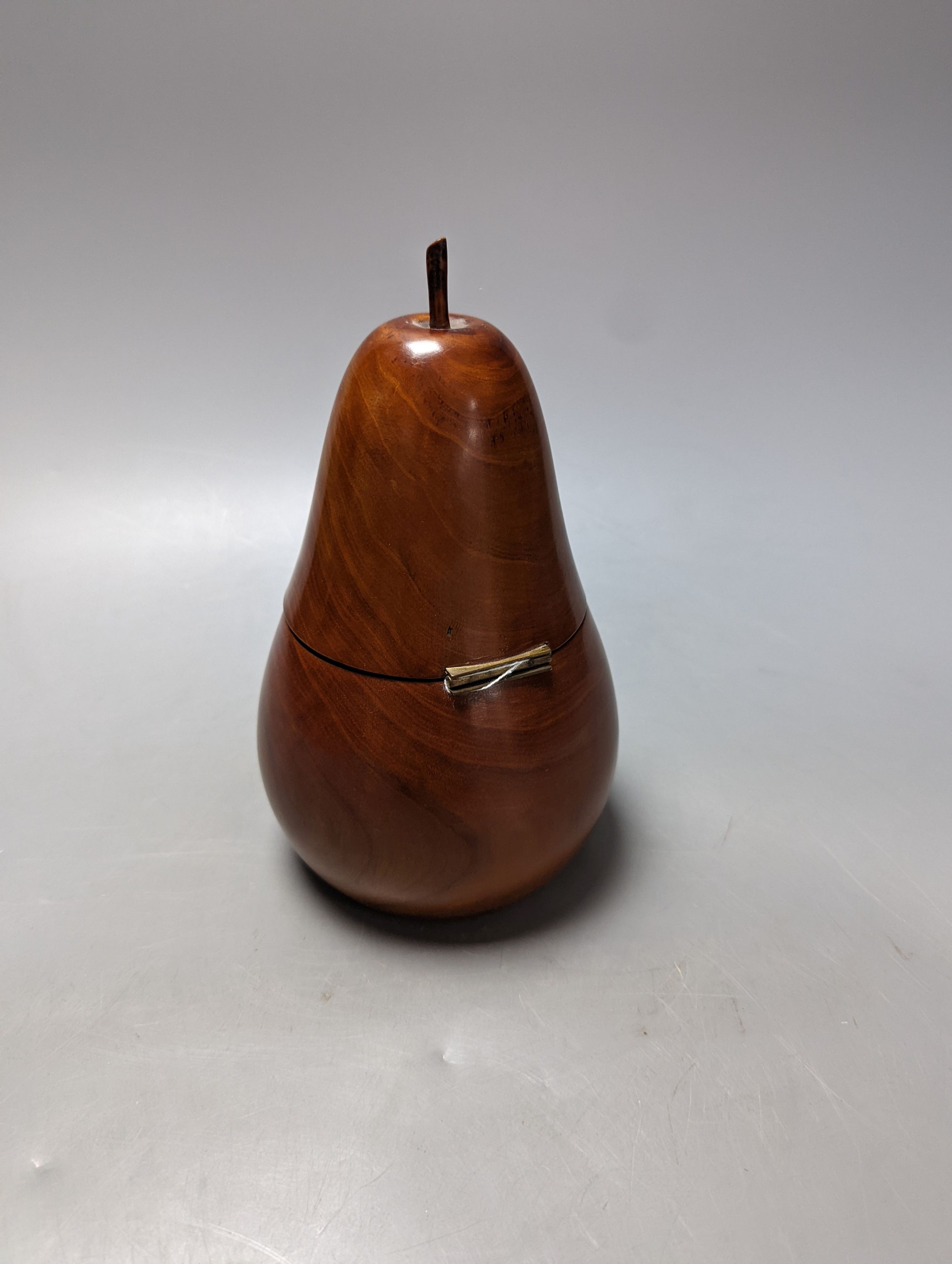 A George III style fruitwood pear shaped tea caddy, 21 cms high.